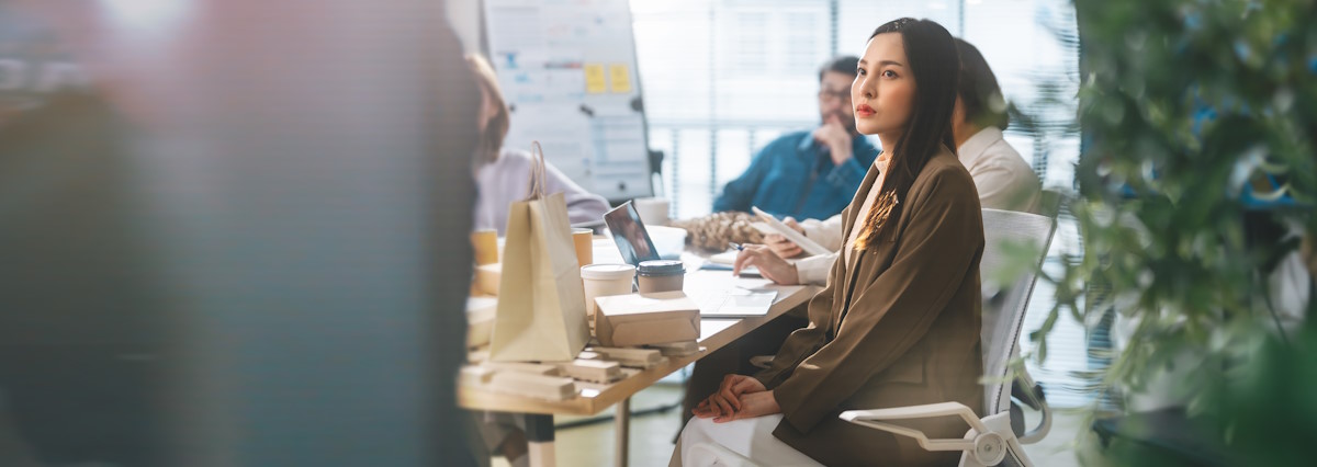 Business asian woman sitting in office meeting presentation ESG and technology innovations recycle material for sustainable product